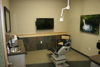 Operating room with dental chair and TV