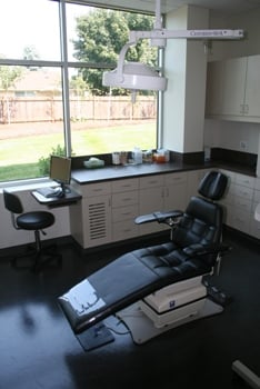 Operating room with dental chair and overhead light