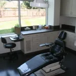 Operating room with dental chair and overhead light